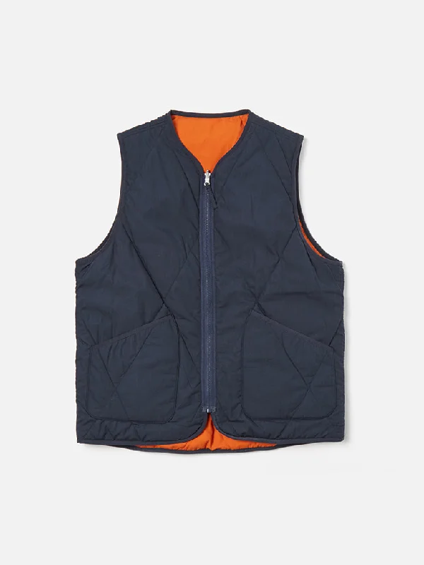 Tailored men vest to pair with a three - piece suitSleeveless Men Waistcoat with a Slim - Fit DesignUniversal Works Reversible Liner Gilet in Navy Orange Tailored men vest to pair with a three - piece suitSleeveless Men Waistcoat with a Slim - Fit DesignUniversal Works Reversible Liner Gilet in Navy Orange