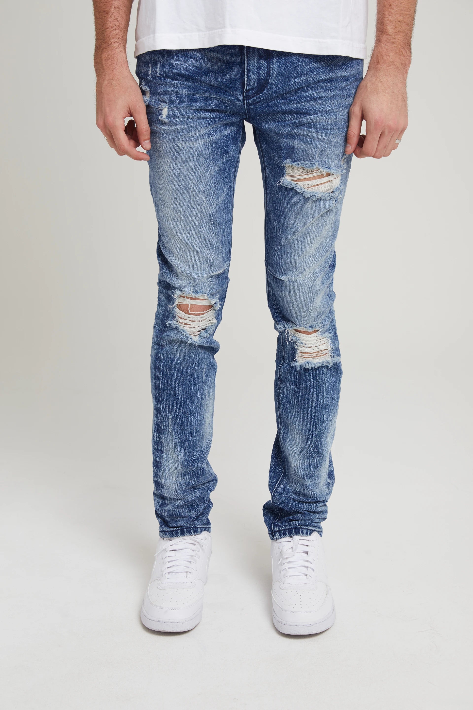 Men's Jeans with a Hidden Coin Pocket for Added ConvenienceCLAYTON SKINNY JEAN | MEDIUM WASH DISTRESSED Men's Jeans with a Hidden Coin Pocket for Added ConvenienceCLAYTON SKINNY JEAN | MEDIUM WASH DISTRESSED