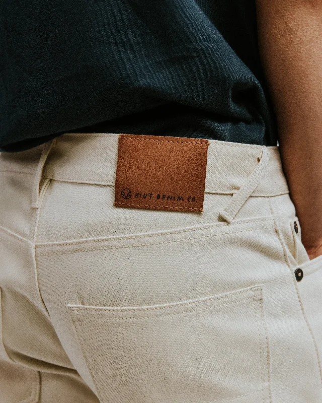 Men's Jeans with a Button - Fly for a Traditional and Classic AestheticThe V-Fit - Tapered - Ecru Denim. Men's Jeans with a Button - Fly for a Traditional and Classic AestheticThe V-Fit - Tapered - Ecru Denim.
