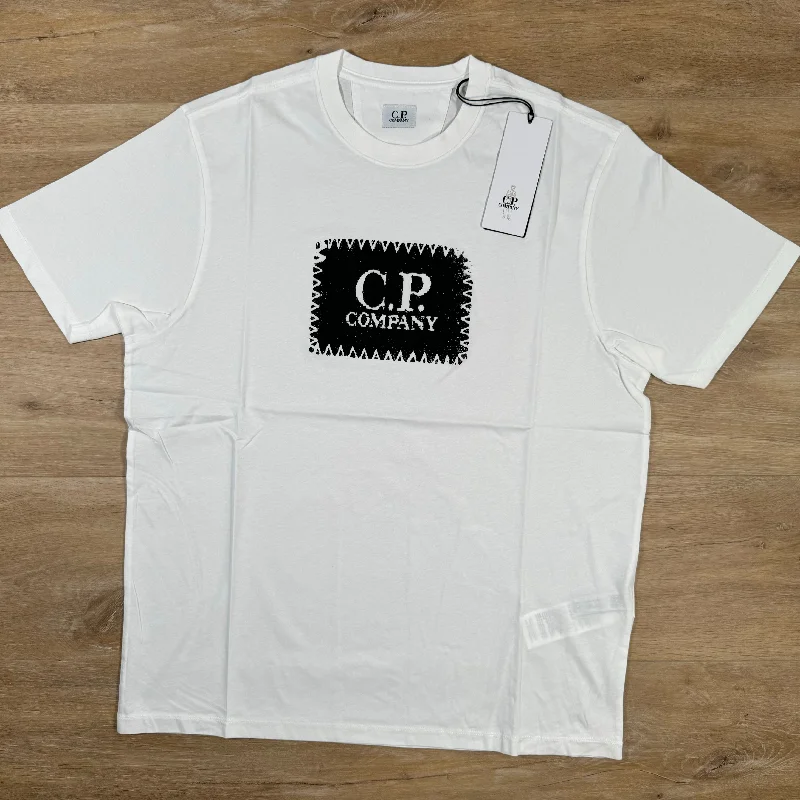 Men's distressed denim - look t - shirts with a rugged appealC.P. Company Stitch Block Logo T-Shirt in White Men's distressed denim - look t - shirts with a rugged appealC.P. Company Stitch Block Logo T-Shirt in White