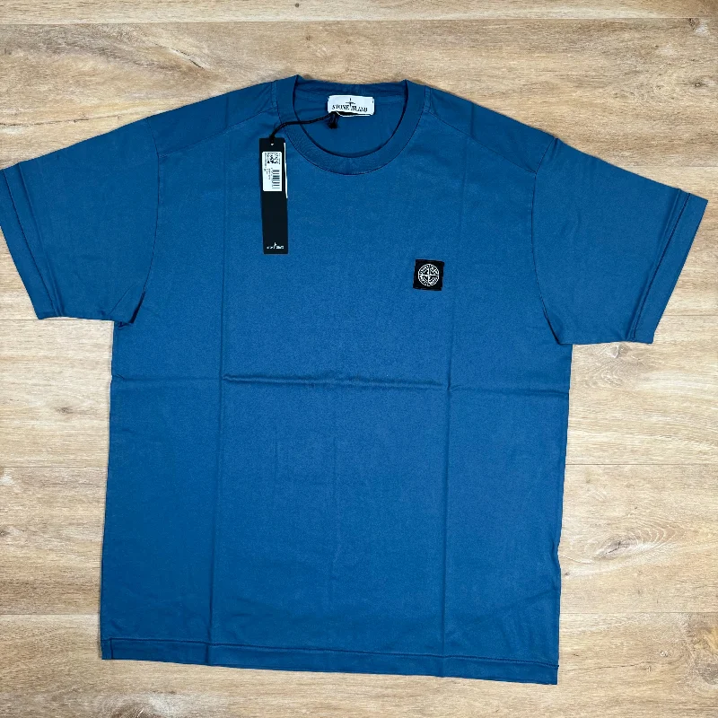 Men's eco - friendly recycled t - shirts for sustainable fashion choicesStone Island Patch Logo T-Shirt in Avio Blue Men's eco - friendly recycled t - shirts for sustainable fashion choicesStone Island Patch Logo T-Shirt in Avio Blue